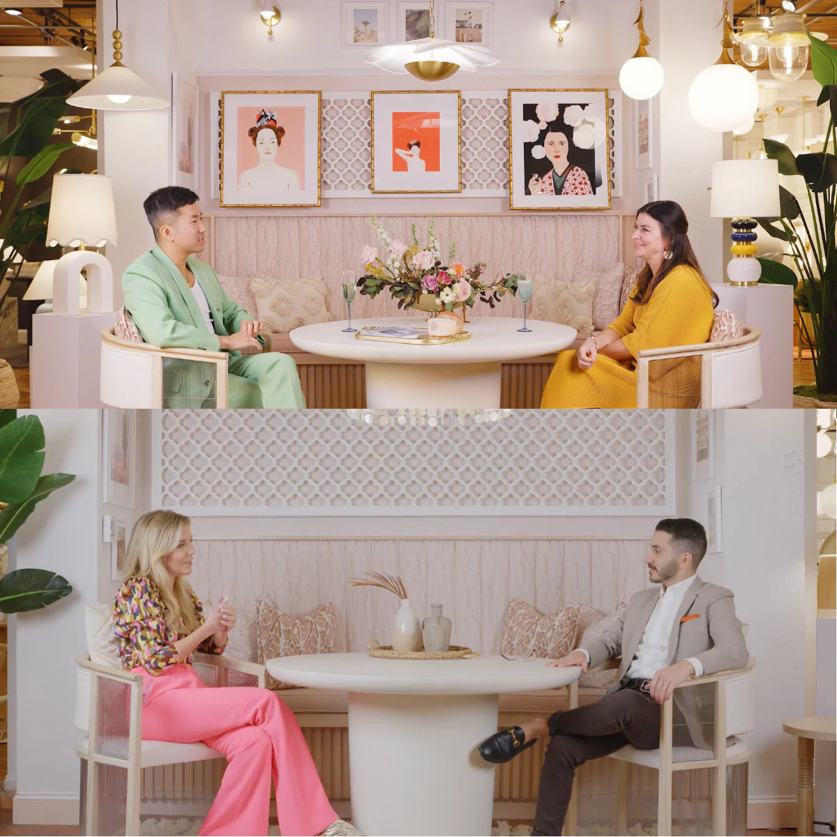 Two designers talking across a round table in a pink, softly lit showroom with framed art and pendant lights