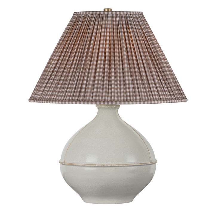 Front view of Salvage table lamp with pale sage ceramic base, distressed seam, and brown gingham shade on white background